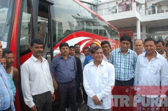 Transport Minister Manik Dey inspects the newly arrived Volvo bus at TRTC